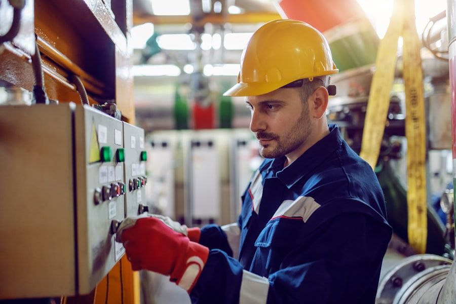 Electrician switching on power at a switchboard